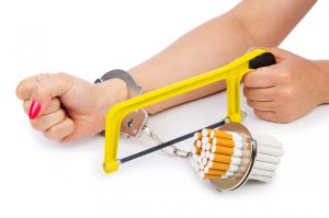 Picture of woman sawing off handcuffs to cigarettes